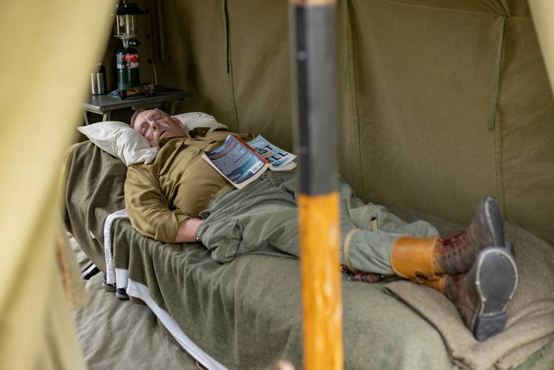 A reenactor takes a nap prior to the simulated battle at the Ottawa Military Show on July 13, 2025 in rural Ottawa.