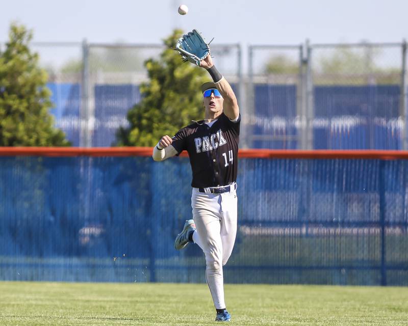 Oswego East's Dominic Battista (14) catches a fly ball in the outfield during baseball game Oswego East at Oswego.  May 14, 2026 in Oswego.