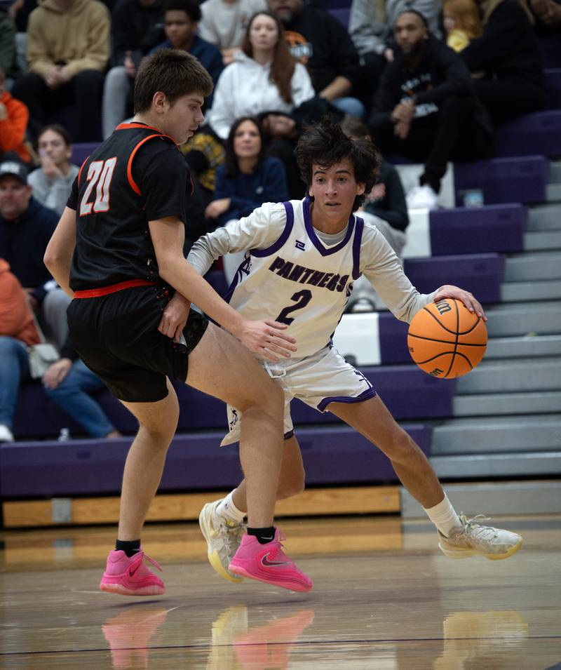 Manteno's Quinn Campbell, right, controls the ball as Beecher's Brian Oldenburg, left, defends in the Thanksgiving tournament at Manteno High School on Monday, November 24, 2025.