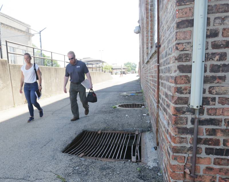 Leah Inman La Salle Economic Development director and engineer Scott Brown of Wendler Engineering Services Inc walk the premises on the exterior of the Hotel Kaskaskia on Thursday, June 16, 2022 downtown La Salle.