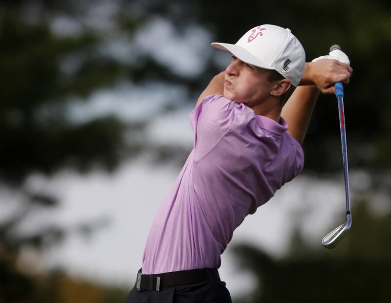 Hampshire’s Nolan Adamczyk watches his tee shot on the eighth hole during the IHSA Class 3A Jacobs Sectional golf tournament on Monday, Oct. 7, 2024, at Randall Oaks Golf Club in West Dundee.
