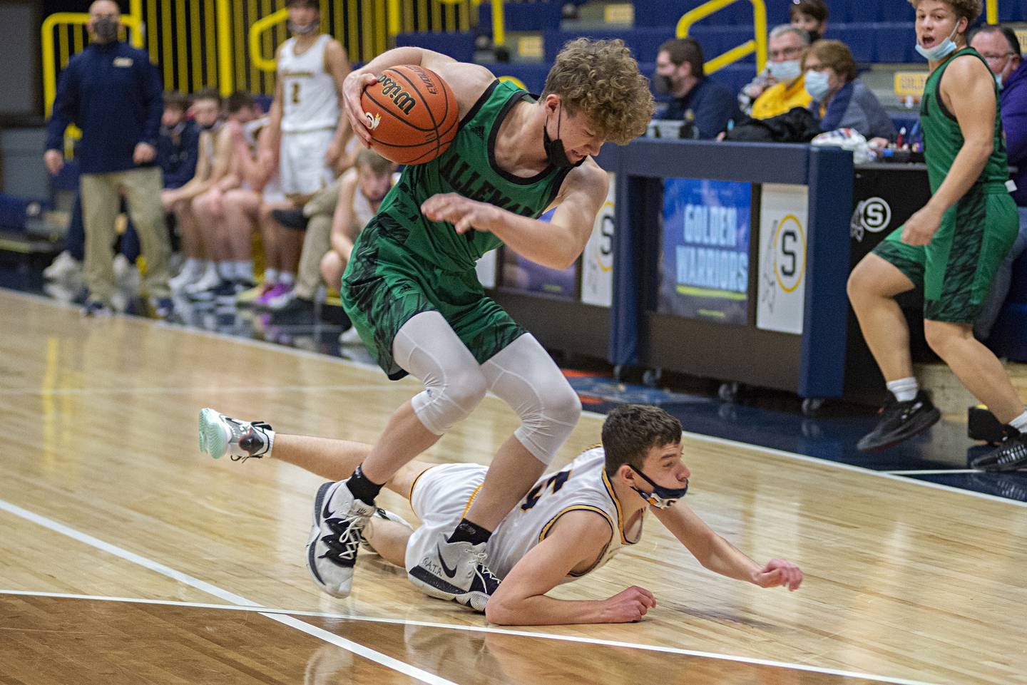 Sterling's Trevor Dir and Alleman's Noah Brinkman battle for a loose ball in Sterling on Friday, Jan. 21, 2022.