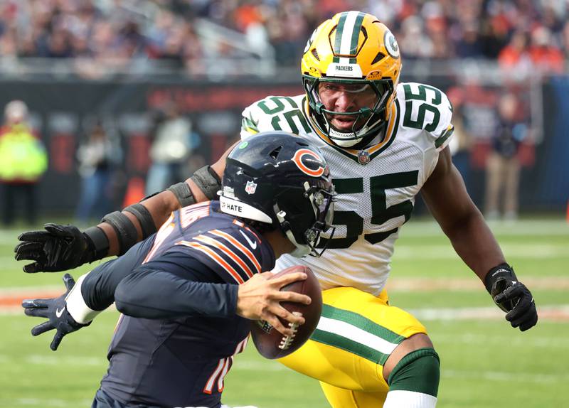 Green Bay Packers defensive end Kingsley Enagbare tries to sack Chicago Bears quarterback Caleb Williams Sunday, Nov. 17, 2024, during their game at Soldier Field in Chicago.
