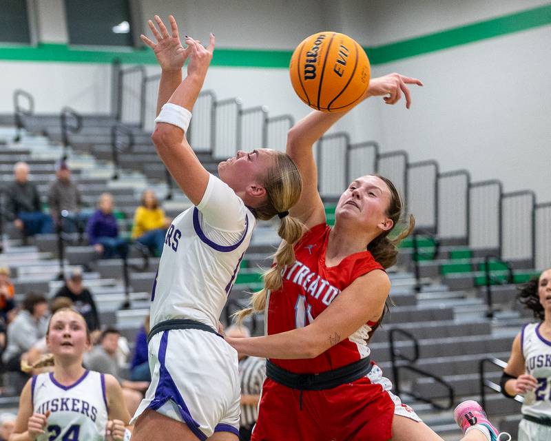Brynley Glade (13) of Serena goes up for layup as Ava Gwaltney (11) of Streator blocks shot on Monday, November 17, 2025 at Seneca High School in Seneca.