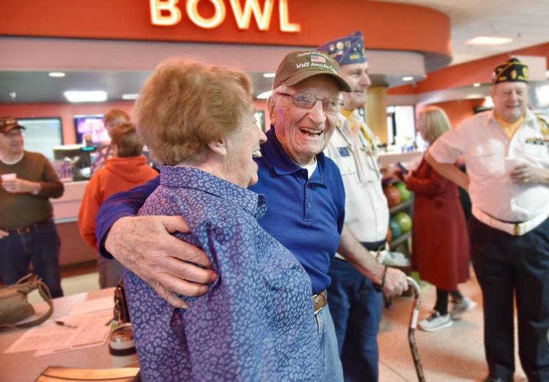 Bowler Ed Berthold, 103, shares a laugh with friend Bridget McGuiness, 93, during his weekly bowling league game Tuesday, Nov. 22, 2022, at Bowlero in Deer Park.