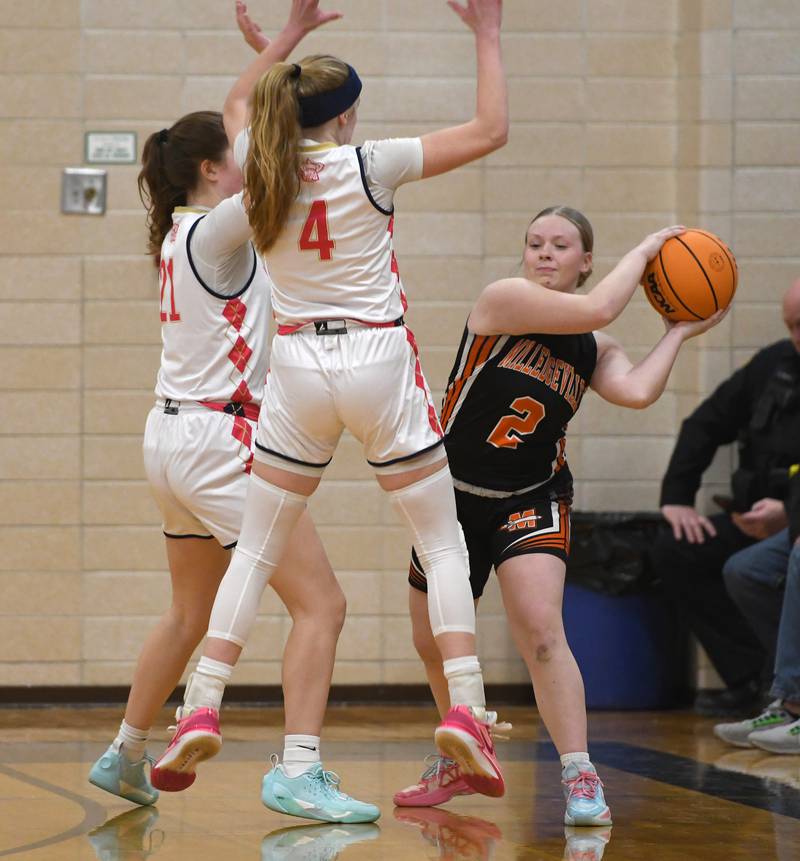 Milledgeville's Megan Schenck (2) passes as Polo's Reese Mekeel (21) and Camrynn Jones (4) defend on Saturday, Jan. 24, 2026 at Polo High School.