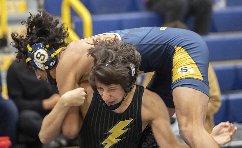 Sterling’s Adrian Pineda is worked on by Galesburg’s Orlando Castellano at 138 pounds Friday, Jan. 31, 2025, during the Western Big 6 conference wrestling tournament held at Sterling High School.