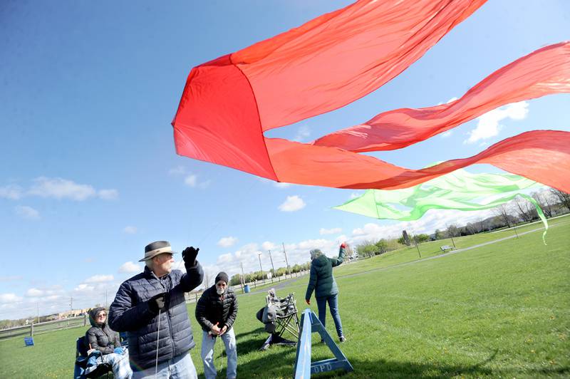 The Curtin Family launches their kites during a celebration of Earth Day and National Kite Month at Prairie Point Park in Oswego, Saturday, April 20, 2024.