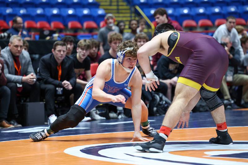Marmion Academy's Grayson Garcia, left, wrestles Montini's Santino Tenuta in the 165-pound match during Marmion Academy's victory over Montini in the IHSA Class 3A Dual Team State championship on Saturday, Feb. 28, 2026.