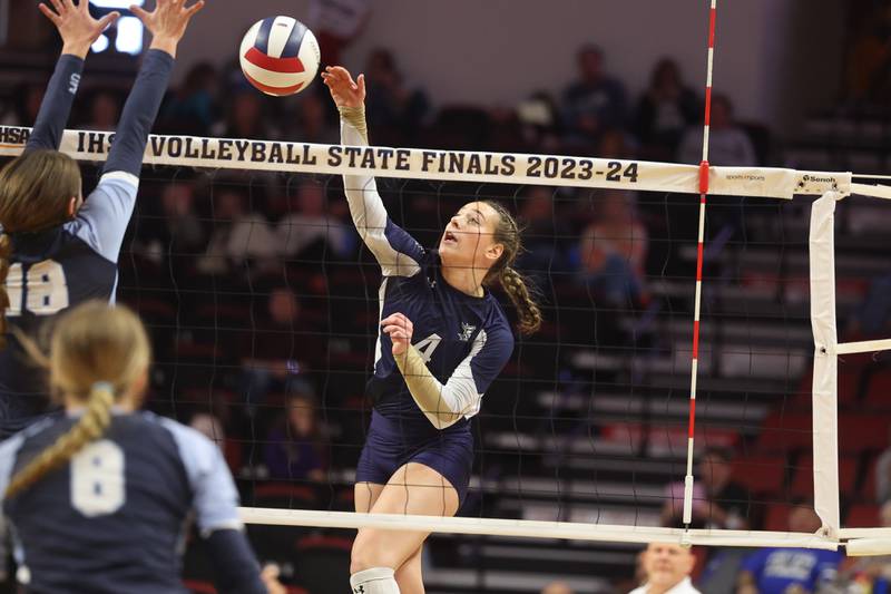 IC Catholic’s Ava Falduto hits a shot against Mater Dei in the Class 2A Volleyball Championship match on Saturday, Nov. 11, 2023 in Normal.