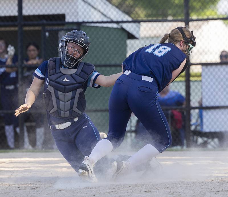 Bureau Valley catcher Emily Wright and Kadyn Haage collide on a pop up at the place against Princeton Friday, May 17, 2024 at the Class 2A regional semifinals in Rock Falls. Wright caught the ball but lost her mitt in the arms of Haage, the ball trickled out for a foul.
