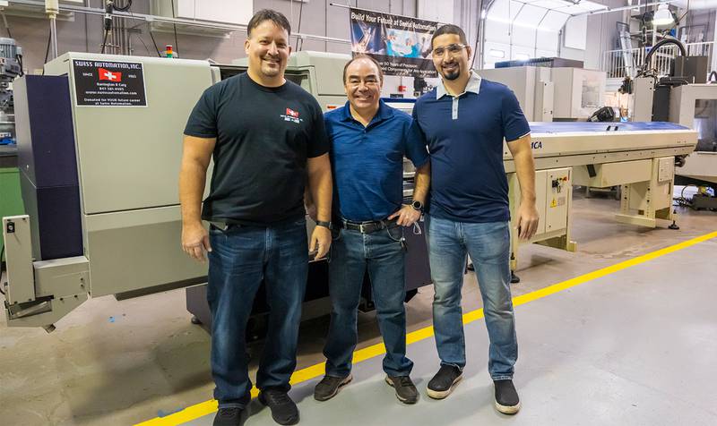 Marc Moran, VP of Operations at Swiss Automation, Inc., Umberto Tinajero, IMT/CIM program coordinator and Alejandro Murillo, IMT/CIM instructor after installation of CNC machine.