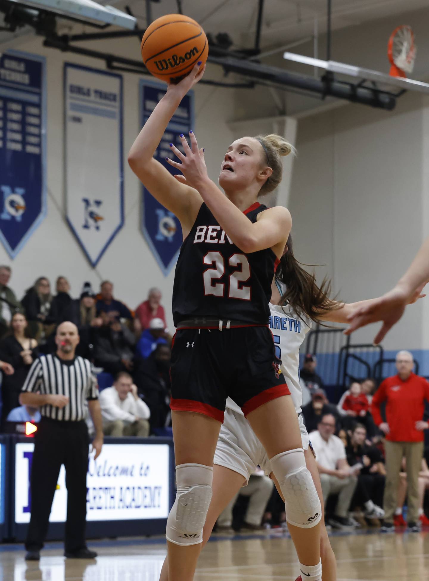 Benet's Bridget Rifenburg (22) takes a shot during a girls varsity basketball game between Benet and Nazareth academies on Saturday, Dec. 14, 2024 in La Grange Park.