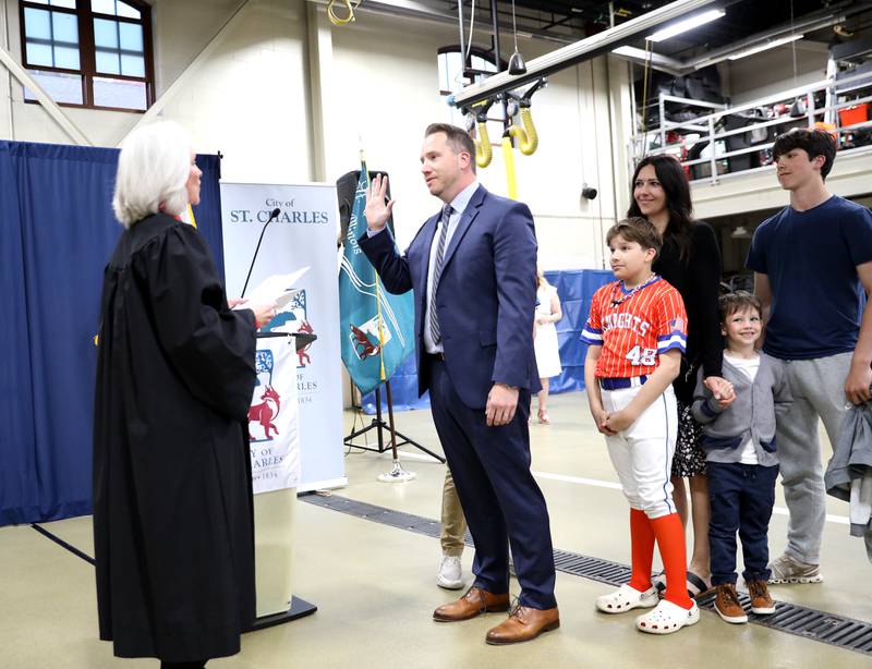 St. Charles Alderperson Ryan Bongard, surrounded by his family, is sworn in by Circuit Court Judge Susan Clancy Boles on Monday, May 5, 2025 at the St. Charles Fire Department.