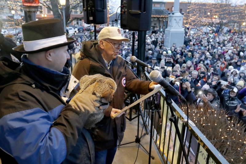 WGN-TV chief meteorologist Tom Skilling reads Woodstock Willie’s prognostication of an early spring on Friday, Feb. 2, 2024, during the annual Groundhog Day Prognostication on the Woodstock Square.