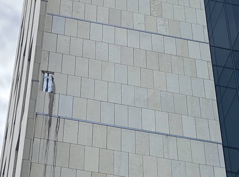A view from outside the Will County Courthouse building on Wednesday, Jan. 15, 2025, showing where the stone tile fell off the building.