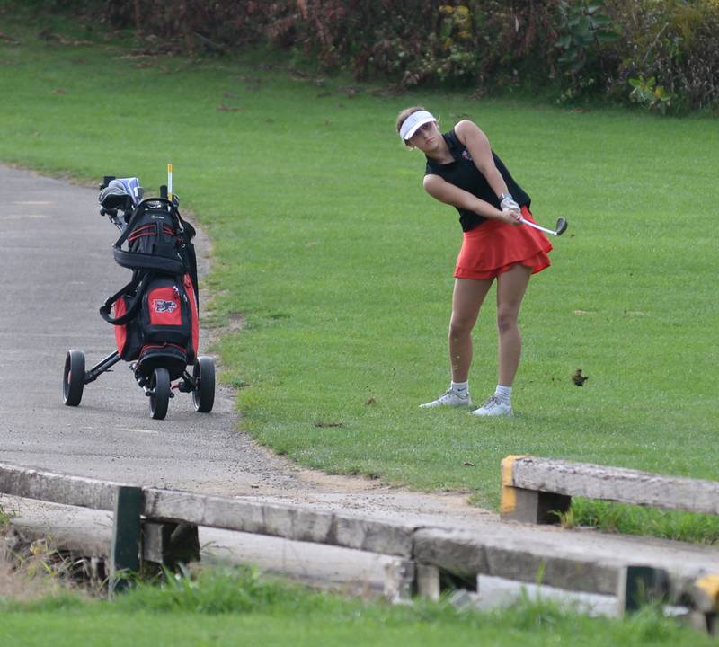 Erie-Prophetstown's Michelle Naftzger watches her chip shot land on the green during a Monday, Aug. 18, 2025 match with Oregon High School at Silver Ridge Golf Course north of Oregon.
