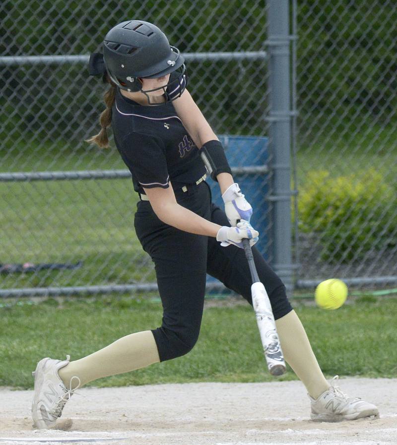 Serena’s Jenna Setchell connects for a triple driving in the 3rd run for Serena against Marquette Friday at Serena.