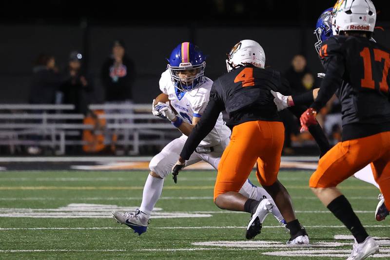 Joliet Central’s Jayden Poplawski rushes to the outside against Plainfield East on Oct. 4, 20234 in Plainfield.