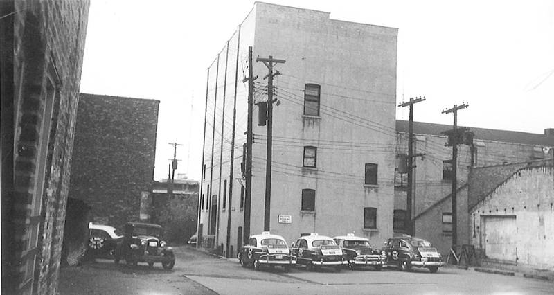 A view from the alley behind Armory Hall at East Locust Street in DeKalb, 1969.