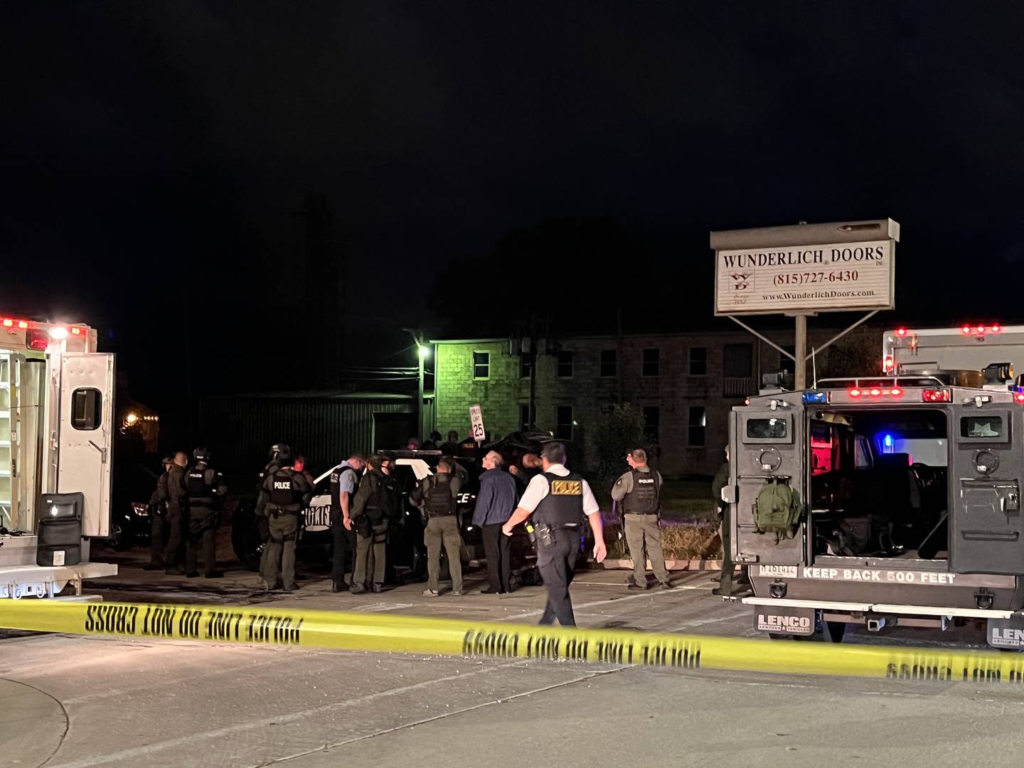 Police officers convene at the 200 block of Center Street in Joliet 10:48 p.m. on Thursday, Oct. 6, 2022.