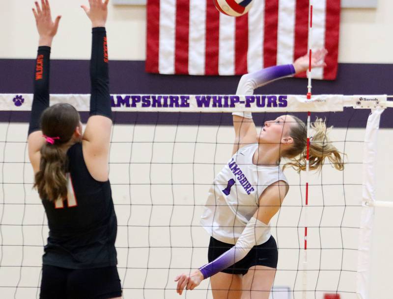 Hampshire’s Elizabeth King hits the ball against Libertyville in an IHSA volleyball Class 4A Sectional Championship at Hampshire High School in Hampshire on Thursday, November 6, 2025.