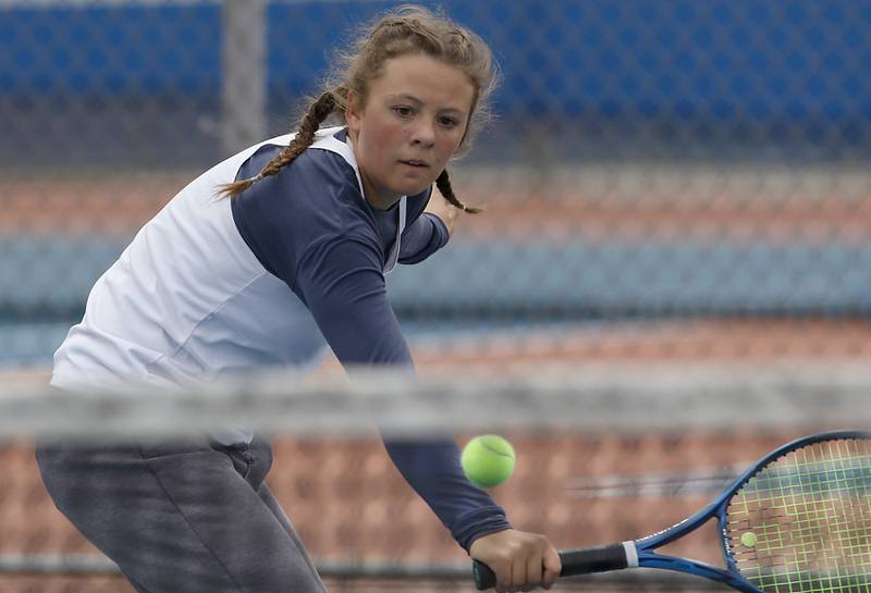Marian Catholic’s Kaitlin returns the ball Thursday, Oct. 20, 2022, during during the first day of the IHSA State Girls Tennis Tournament at Hoffman Estates High School in Hoffman Estates.