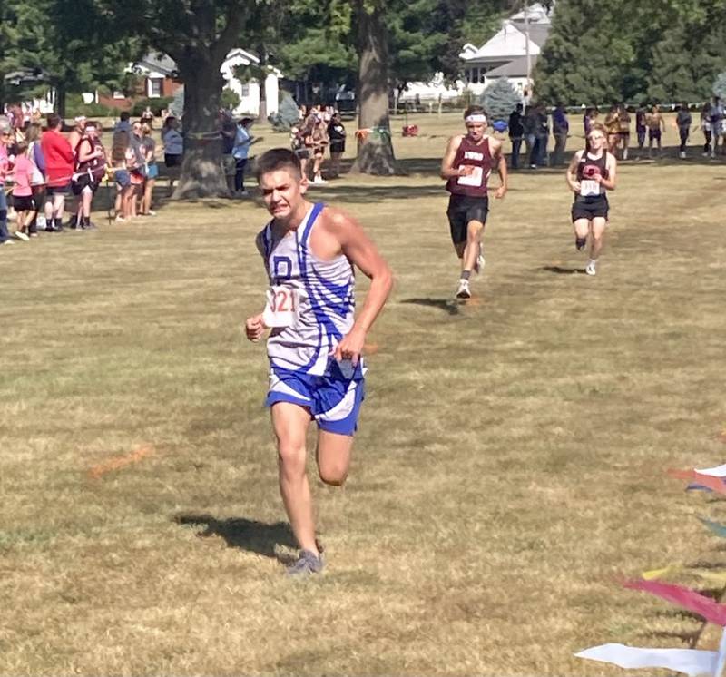 Princeton's Dawson Lambert pushes for the finish line in Saturday's Gary Coates Invitational in Princeton.