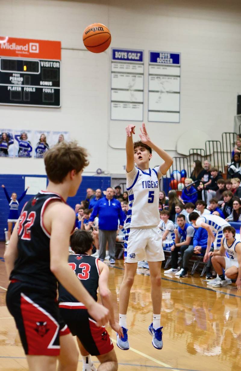 Princeton senior Wyatt Koning launches a a shot in the first half of Friday's Senior Night game against Hall. The Tigers won 51-29.