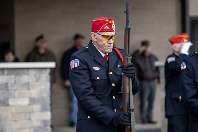 David Lagger, of the Abraham Lincoln National Cemetery Memorial Squad, participates in a rifle salute during a Veterans Day ceremony at American Legion Post 1080 in Joliet on Nov. 11, 2025.