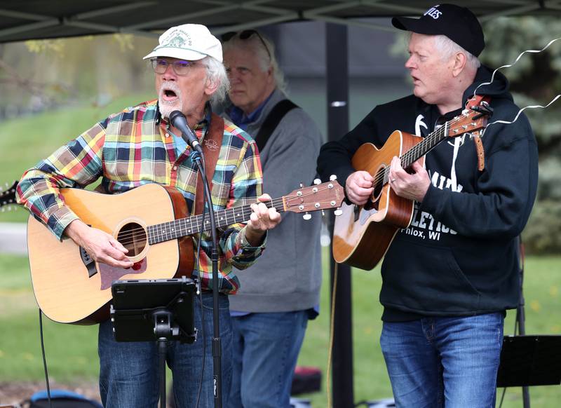Musicians sing protest and patriotic songs Saturday, May 3, 2025, at Hopkins Park in DeKalb during a May Day Rally for Democracy to protest against Trump administration policies.