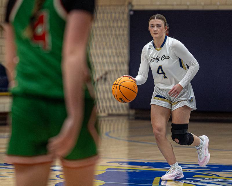 Hunter Hopkins (4) of Marquette dribbles ball down lane on Saturday, January 3, 2026 at Marquette Academy in Ottawa.