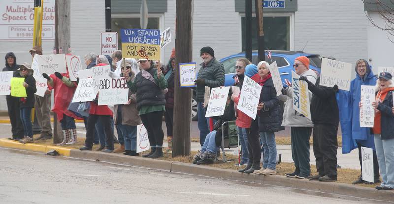 Dozens of citizens gather during a March 4 Democracy on Tuesday, March 4, 2025 at Rotary Park in Princeton. Participants brought signs to feature issues of concern for the county, state and country. The event was sponsored by concerned citizens of Bureau County.