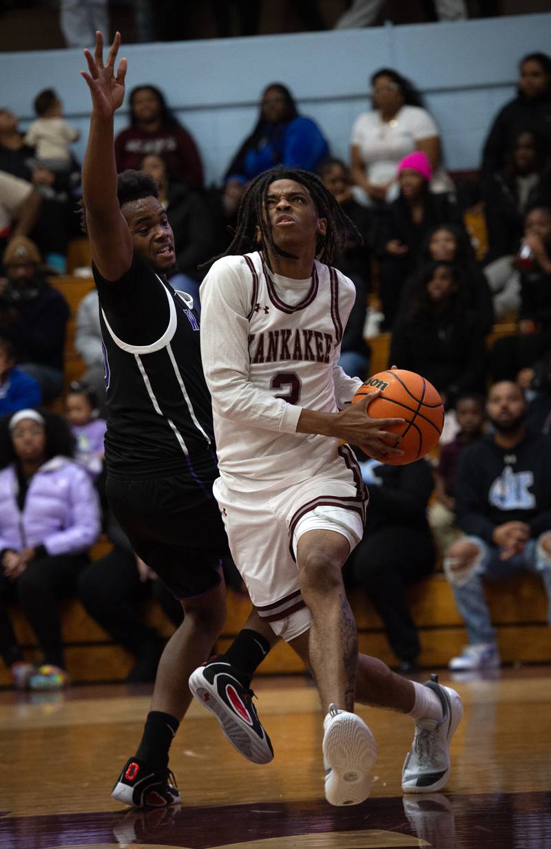 Kankakee's Kenaz Jackson Jr, right, makes a break toward the net past Thornton's Joseph Thomas, left, in a game on Friday, December 12, 2025.