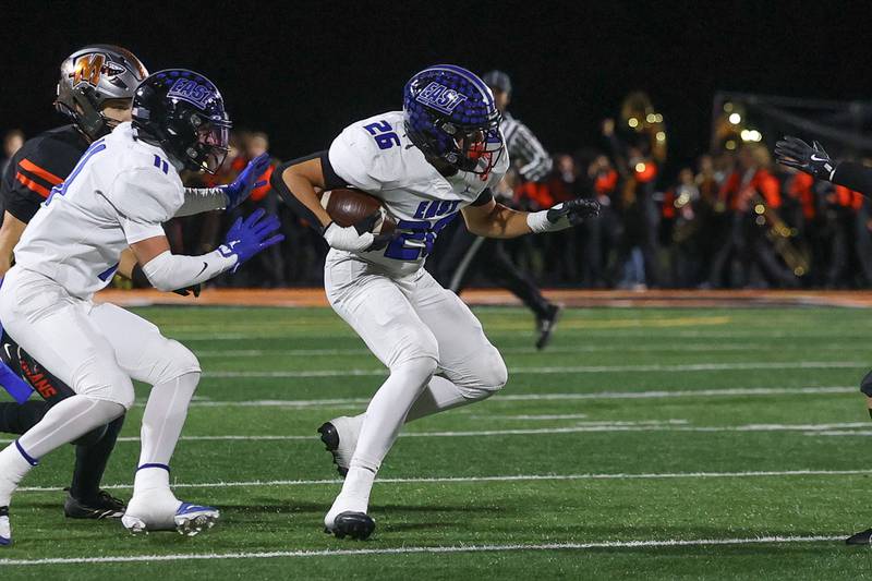 Lincoln-Way East’s Warren Yanong returns an interception against Minooka on Friday, Nov. 8, 2024 in Minooka.