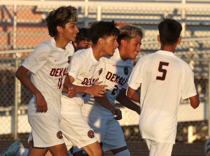 DeKalb players celebrate the first goal of the game against St. Edward Thursday, Aug. 28, 2025, during their game in the Barb Cup tournament at DeKalb High School.