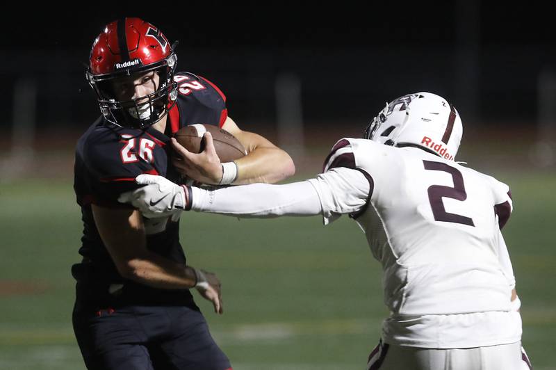 Huntley's Chase Hojnacki cuts away from Prairie Ridge's Logan Thennes during a Fox Valley Conference football game on Friday, Oct. 3, 2025, at Huntley High School.