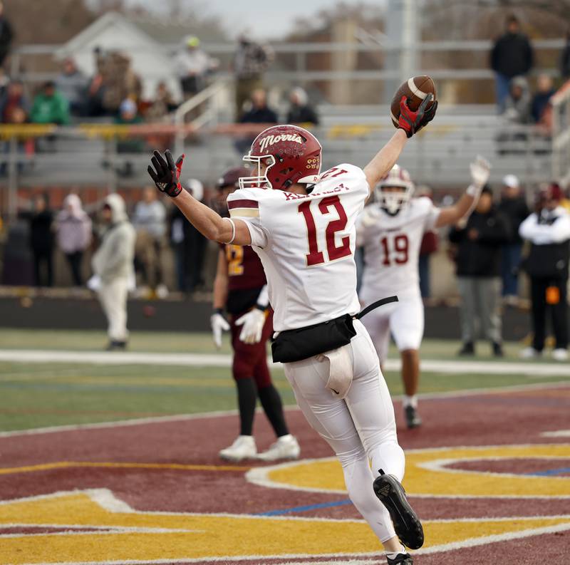 Morris' R.J. Kennedy (12) celebrates a touchdown during the IHSA Class 4A semifinals football playoff game Saturday, Nov. 22, 2025 in Lombard.
