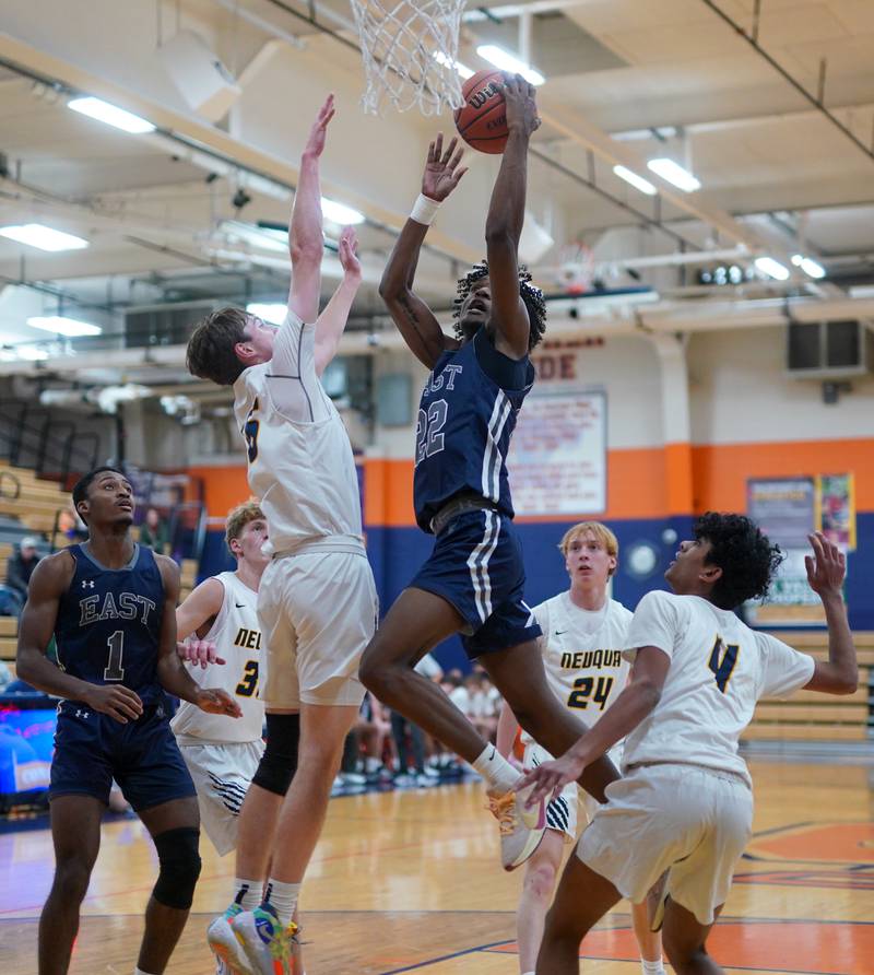 Oswego East's Jehvion Starwood (22) drives to the basket against Neuqua Valley during a hoops for healing basketball tournament game at Oswego High School on Friday, Nov 24, 2023.