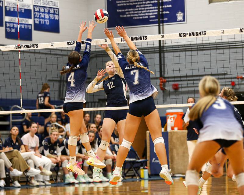 IC Catholic Prep's Maura Grogan (12) tips the ball over the net during volleyball match between Nazareth at IC Catholic Prep.  Aug 29, 2023.