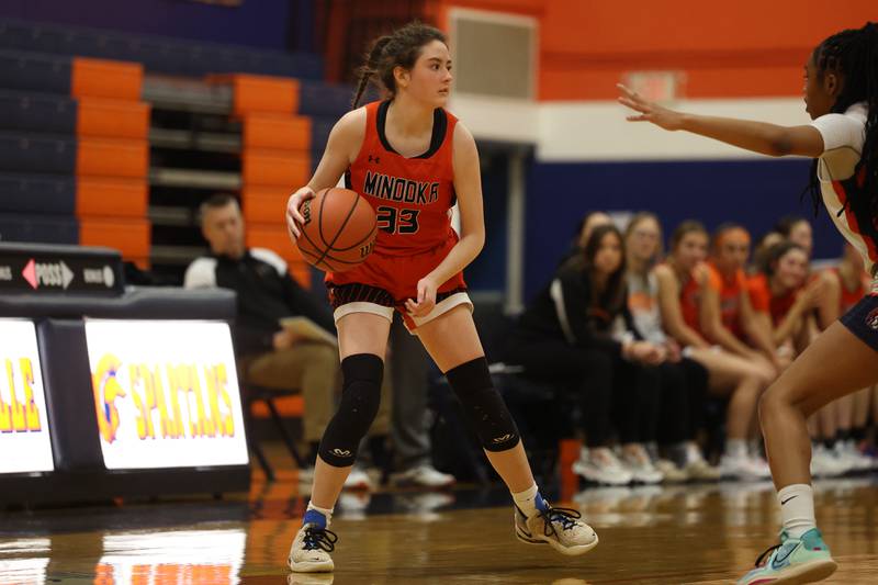 Minooka’s Kylie Loomis looks for a play against Romeoville on Tuesday January 24th, 2023.