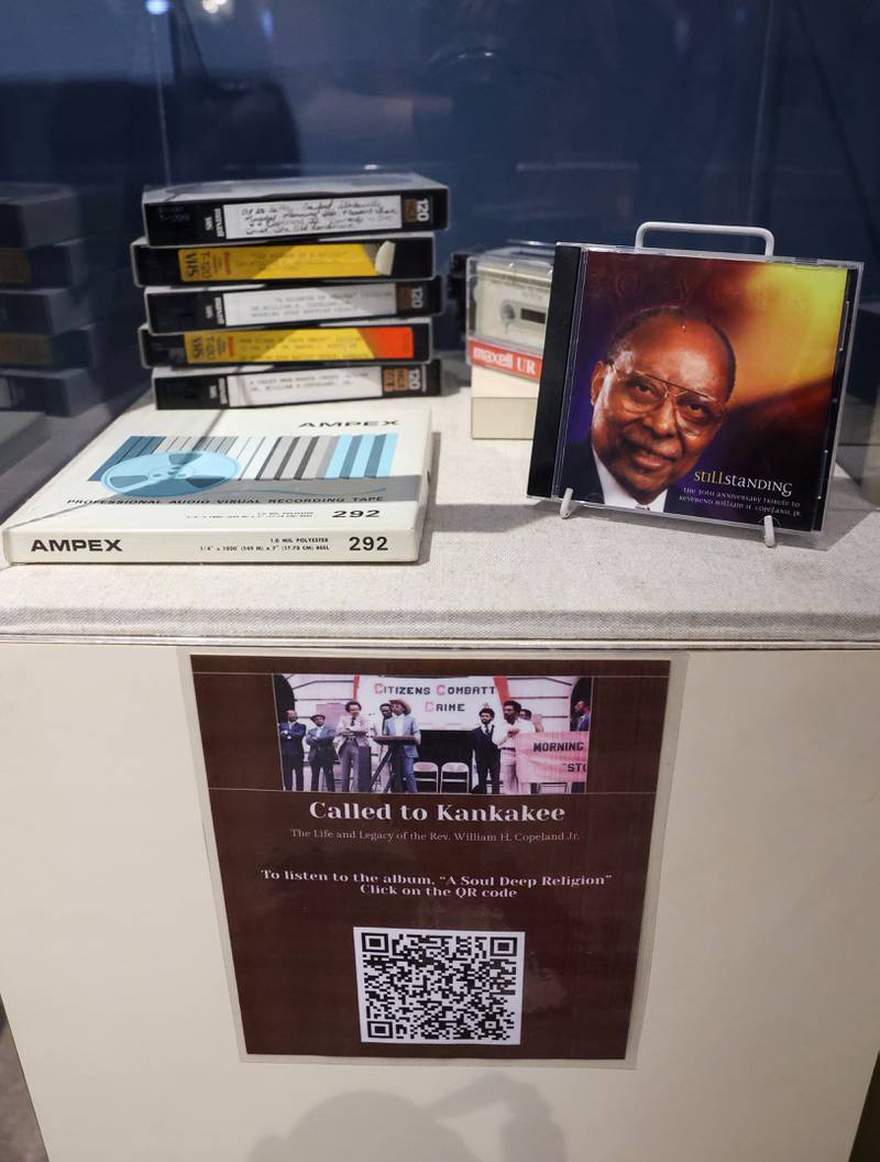 A collection of sermons by the late Kankakee civil rights leader Rev. William Copeland are displayed at the opening of the exhibit 'Called to Kankakee: The Life and Legacy of the Rev. William H. Copeland Jr.' at the Kankakee County Museum on Saturday, Feb. 7, 2026. Scanning the QR code links to a recording of the Reverend’s dynamic message and delivery.