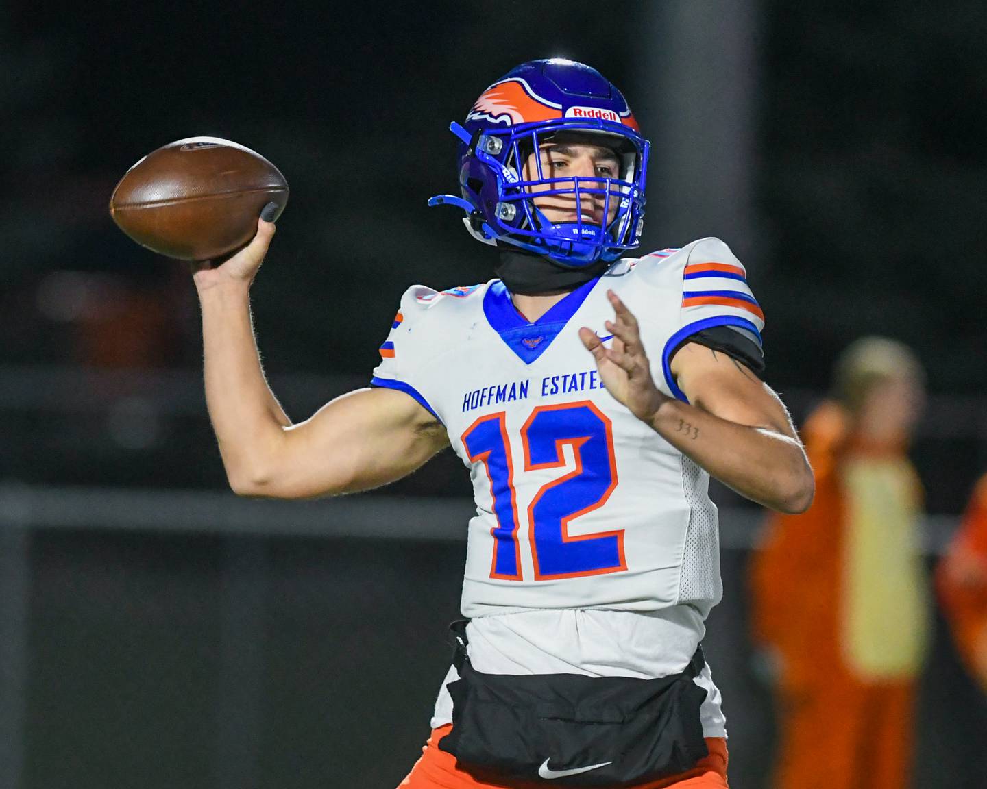 Hoffman Estates's Austin Lezniak (12) passes the ball during the first round of playoffs on Friday Oct. 31, 2025, while traveling to take on Batavia High School.