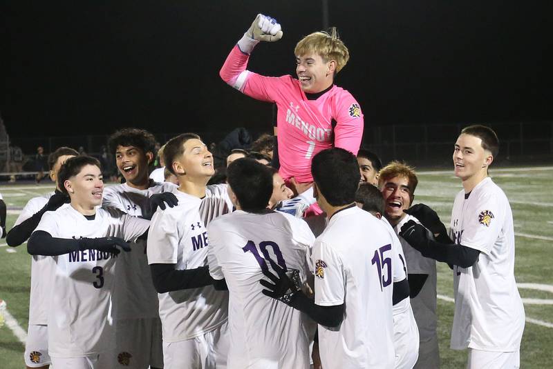 Mendota keeper Mateo Goy is carried off of the field by members of the Mendota boys soccer team after defeating Quincy Notre Dame during the Class 1A Supersectional game on Monday, Nov. 3, 2025 at Mendota High School.