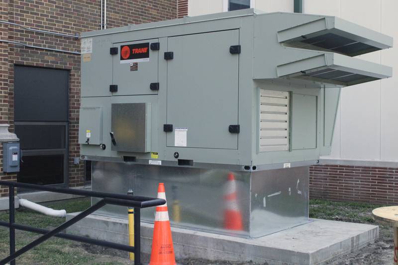 One of the heat, air and ventilation units being installed at Rock Falls High School sits on a concrete slab on the east side of the campus.