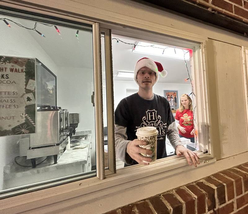 Christopher and Donna Cowley were serving Hazel's hot cocoa at the Sarah Phelps Community Plaza during Oregon's Candlelight Walk on Saturday, Nov. 30, 2024.