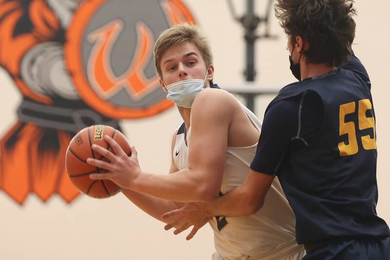 Lemont’s Patrick Gardner looks to pass against Neuqua Valley in the Warrior Showdown shootout at Lincoln-Way West. Saturday, Jan. 29, 2022 in New Lenox.
