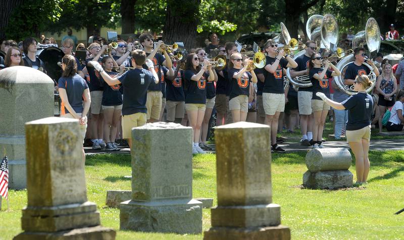 The Oswego High School Marching Band plays Amazing Grace of the Township Cemetery during the annual Memorial Day Parade and Service, Monday, May 29, 2023.