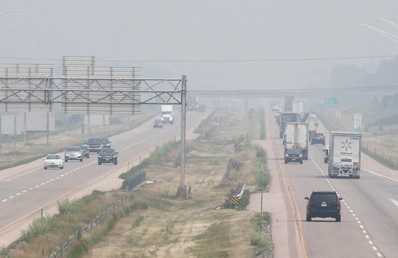Traffic on I-88 looking east from Peace Road in DeKalb drives into the haze from the Canadian wildfires Wednesday, June 28, 2023, in Cortland Township. Smoke from the fires in Canada has moved south into Illinois causing poor air quality that may be unhealthy especially to those with sensitive respiratory systems.