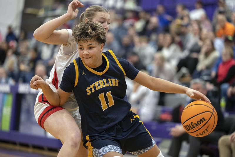 Sterling’s Joslynn James works against Stillman Valley’s Sydney Musial Saturday, Dec. 27, at the Duchesses Basketball Christmas Classic.